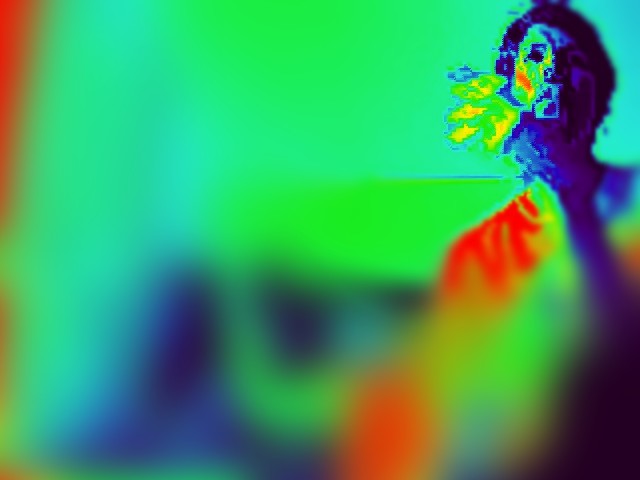 Like3 Mad sat with his hand near his mouth with blurry image background.